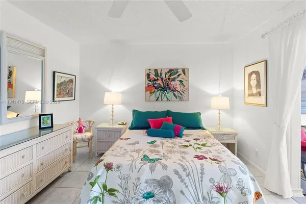 a bedroom with a large bed and a closet