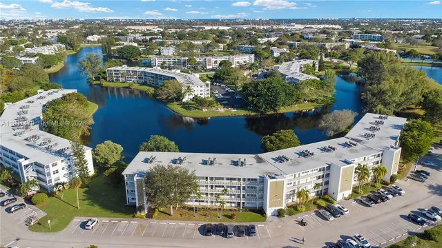 an aerial view of a house with a yard lake view and mountain view