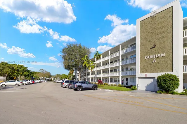 a view of street with parked cars