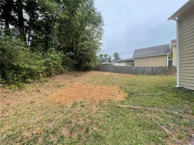 a view of a yard with an trees