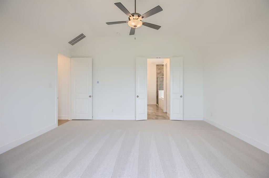 2620 Cedar Rdg Road Celina, TX 75009 - Photo 13 of 27 Unfurnished bedroom featuring light carpet, vaulted ceiling, and ceiling fan