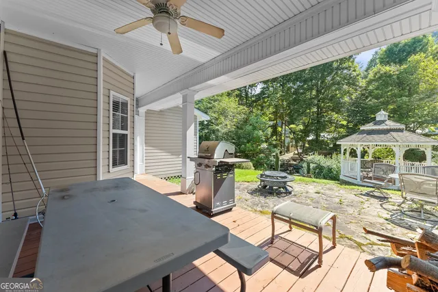 an aerial view of a house with swimming pool outdoor seating and yard
