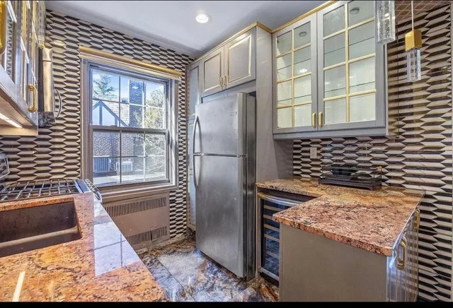 a view of a refrigerator and car parked in the parking