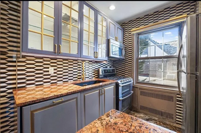 a kitchen with a stove and a sink