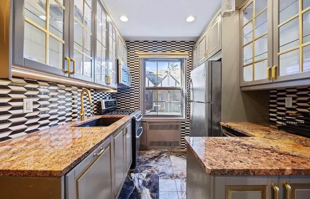 a kitchen with a stove and a sink