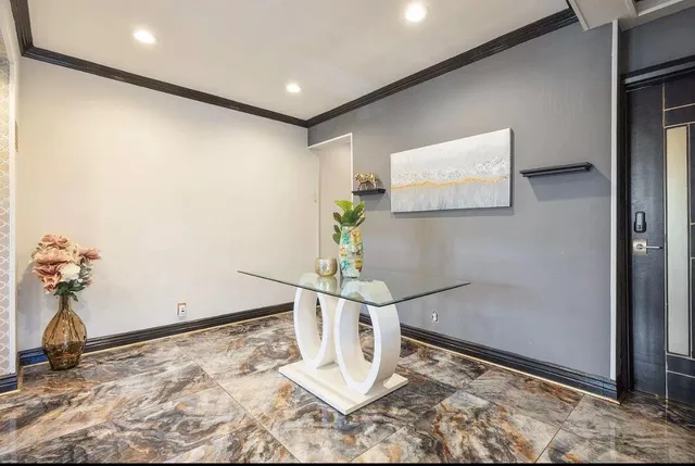 a living room with furniture a rug and a window