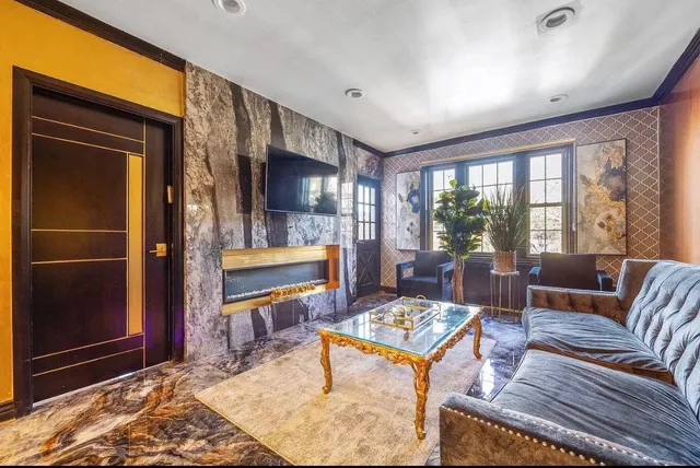 a living room with furniture and a flat screen tv