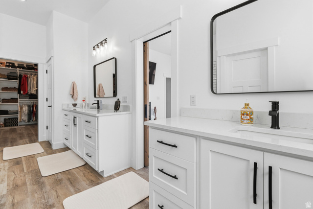 886 North 300th East Spring City, UT 84662 - Photo 27 of 40 Full bath featuring a spacious closet, light wood finished floors, and two vanities