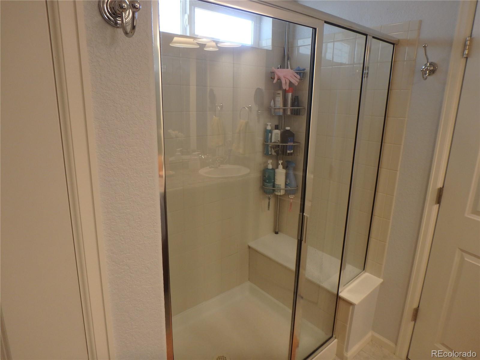 3268 Raintree Lane Dacono, CO 80514 - Photo 23 of 35 a bathroom with a shower