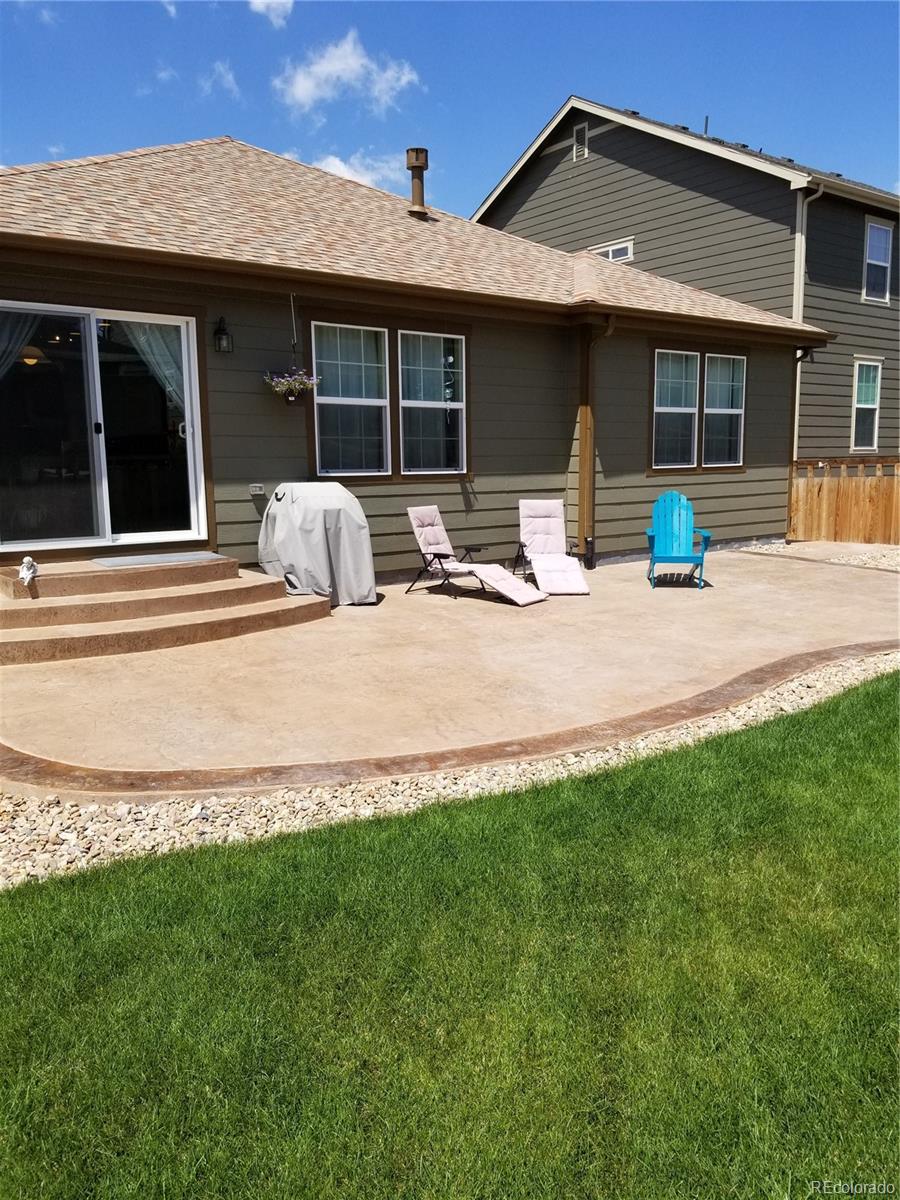 3268 Raintree Lane Dacono, CO 80514 - Photo 27 of 35 a view of a house with backyard and porch