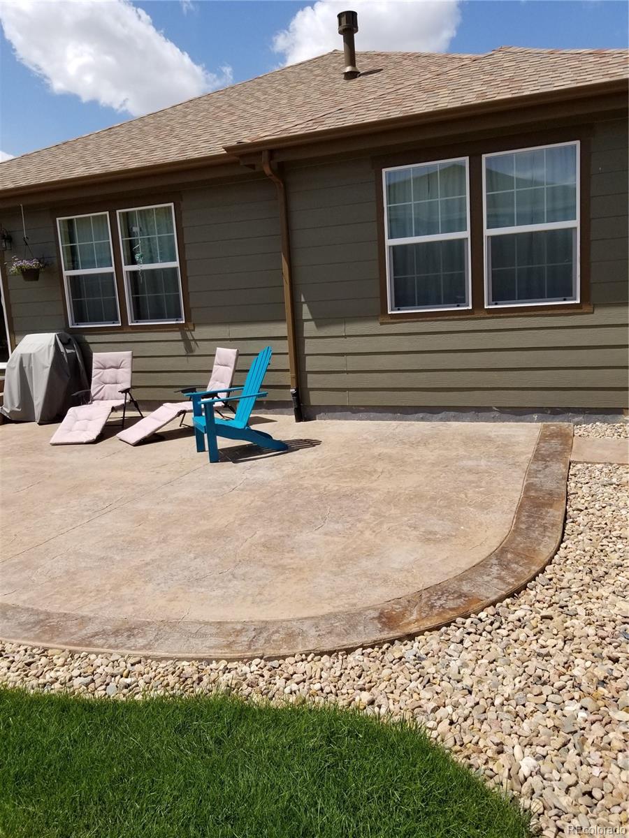 3268 Raintree Lane Dacono, CO 80514 - Photo 28 of 35 a view of a lounge chair in the patio