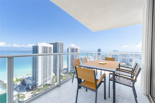 a terrace with a table and chairs