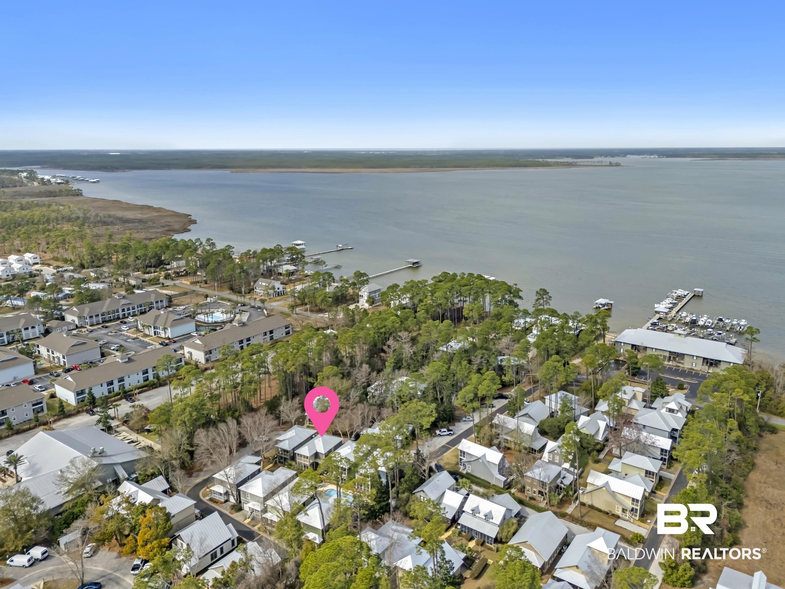 25773 Canal Road, Unit 32 Orange Beach, AL 36561 - Photo 35 of 35 Aerial perspective of suburban area featuring a nearby body of water