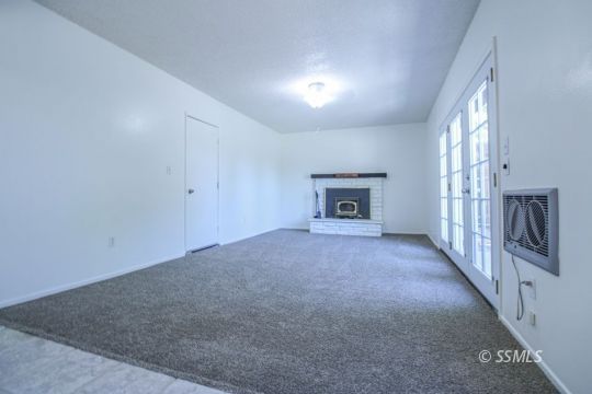 432 Debra Lane Ridgecrest, CA 93555 - Photo 22 of 39 a view of empty room with a fireplace