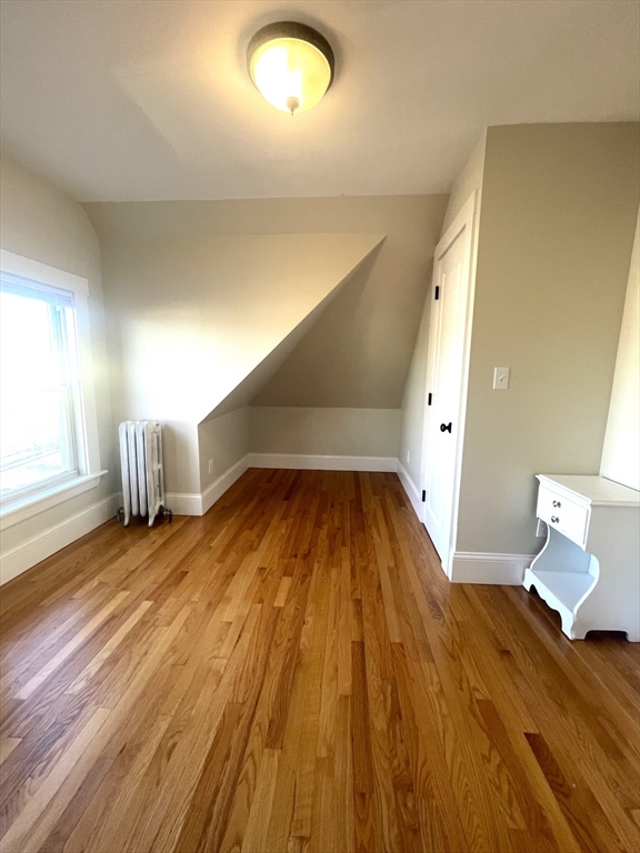 22 Mansfield Street, Unit 2 Boston, MA 02134 - Photo 11 of 18 a view of empty room with wooden floor
