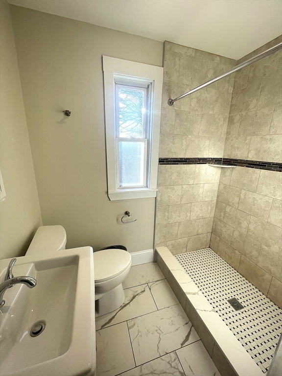 22 Mansfield Street, Unit 2 Boston, MA 02134 - Photo 15 of 18 a bathroom with a toilet and shower