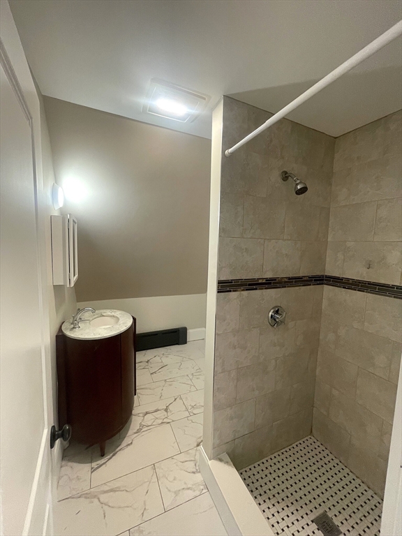 22 Mansfield Street, Unit 2 Boston, MA 02134 - Photo 8 of 18 a bathroom with a sink and mirror