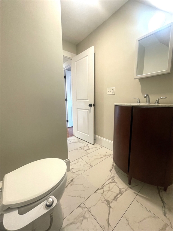 22 Mansfield Street, Unit 2 Boston, MA 02134 - Photo 9 of 18 a bathroom with a toilet