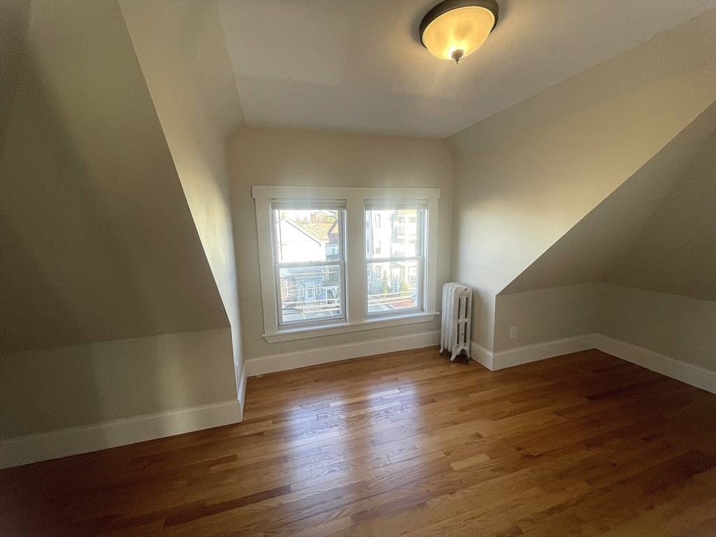 22 Mansfield Street, Unit 2 Boston, MA 02134 - Photo 10 of 18 a view of livingroom with hardwood floor and window