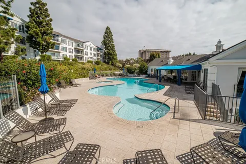 a view of a house with swimming pool patio and sitting area