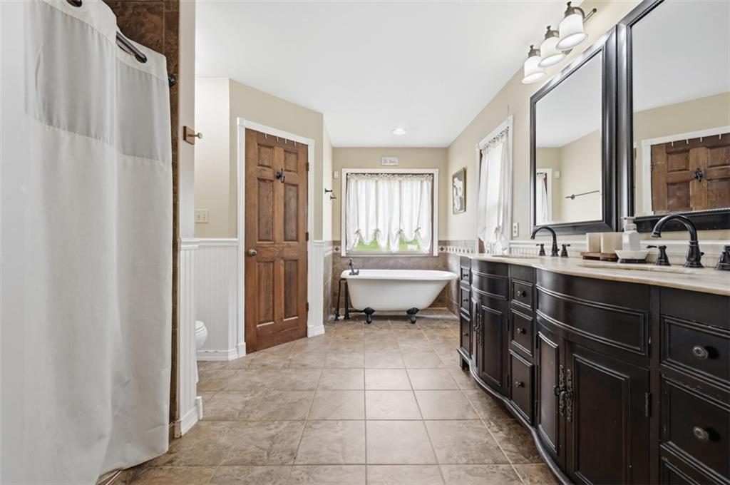 326 Quarry Road Washington, PA 15301 - Photo 23 of 50 Spa-like owner's suite. Walk-in closet and ceramic shower. Doube-bowl sink