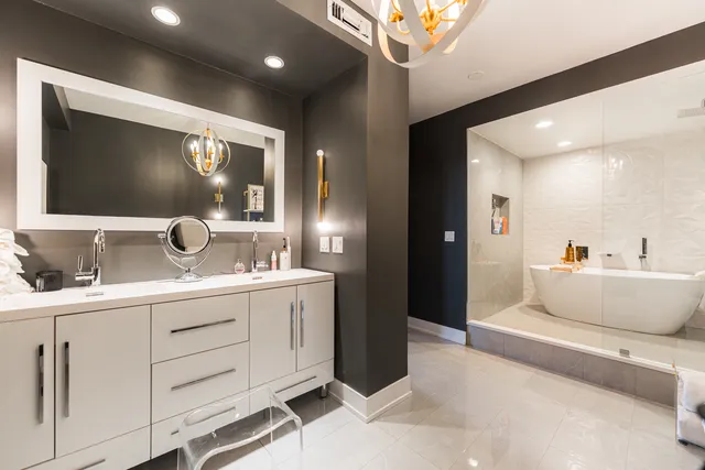 a spacious bathroom with a double vanity sink and a mirror