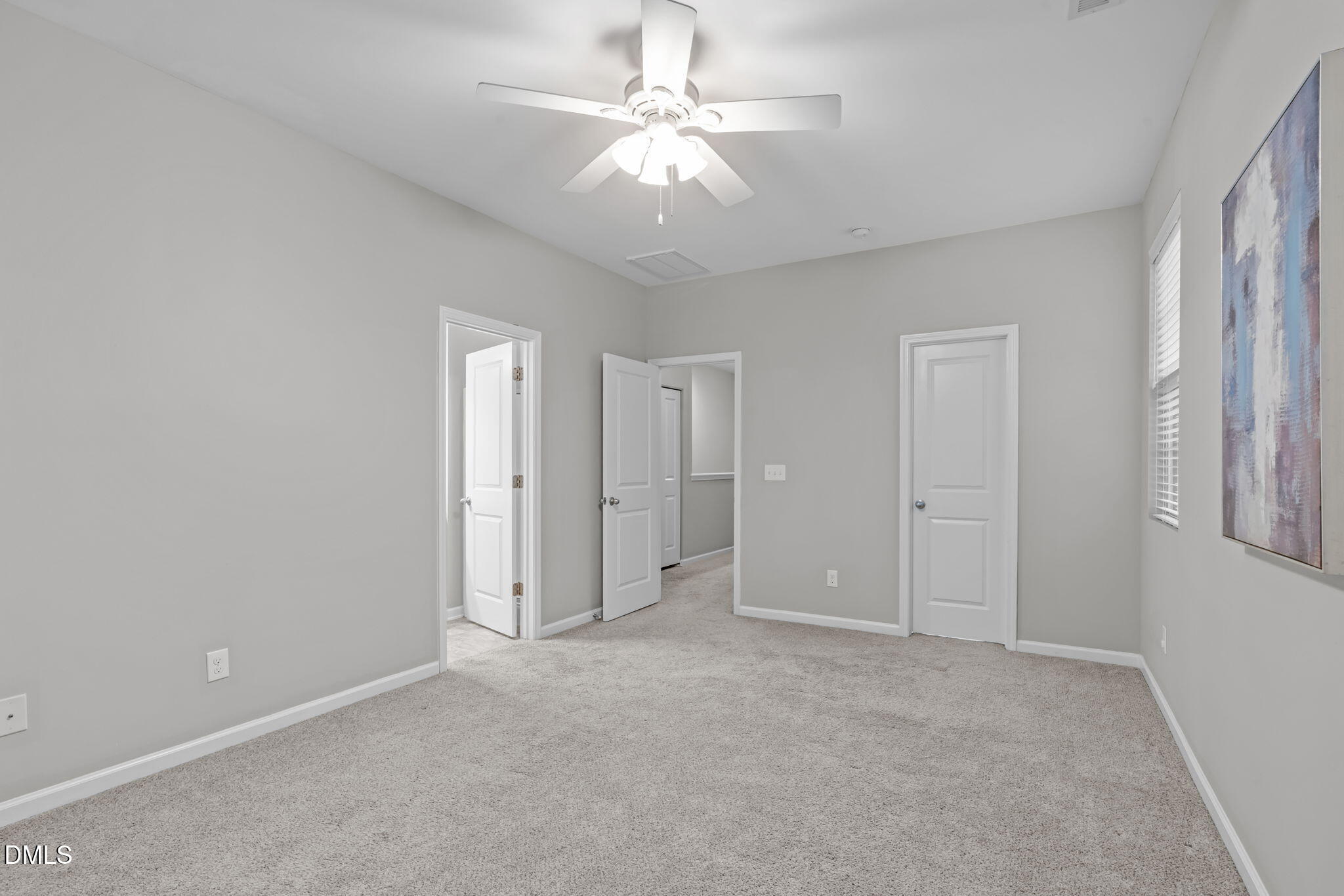 738 Wickham Ridge Road Apex, NC 27539 - Photo 11 of 27 a view of an empty room with a ceiling fan