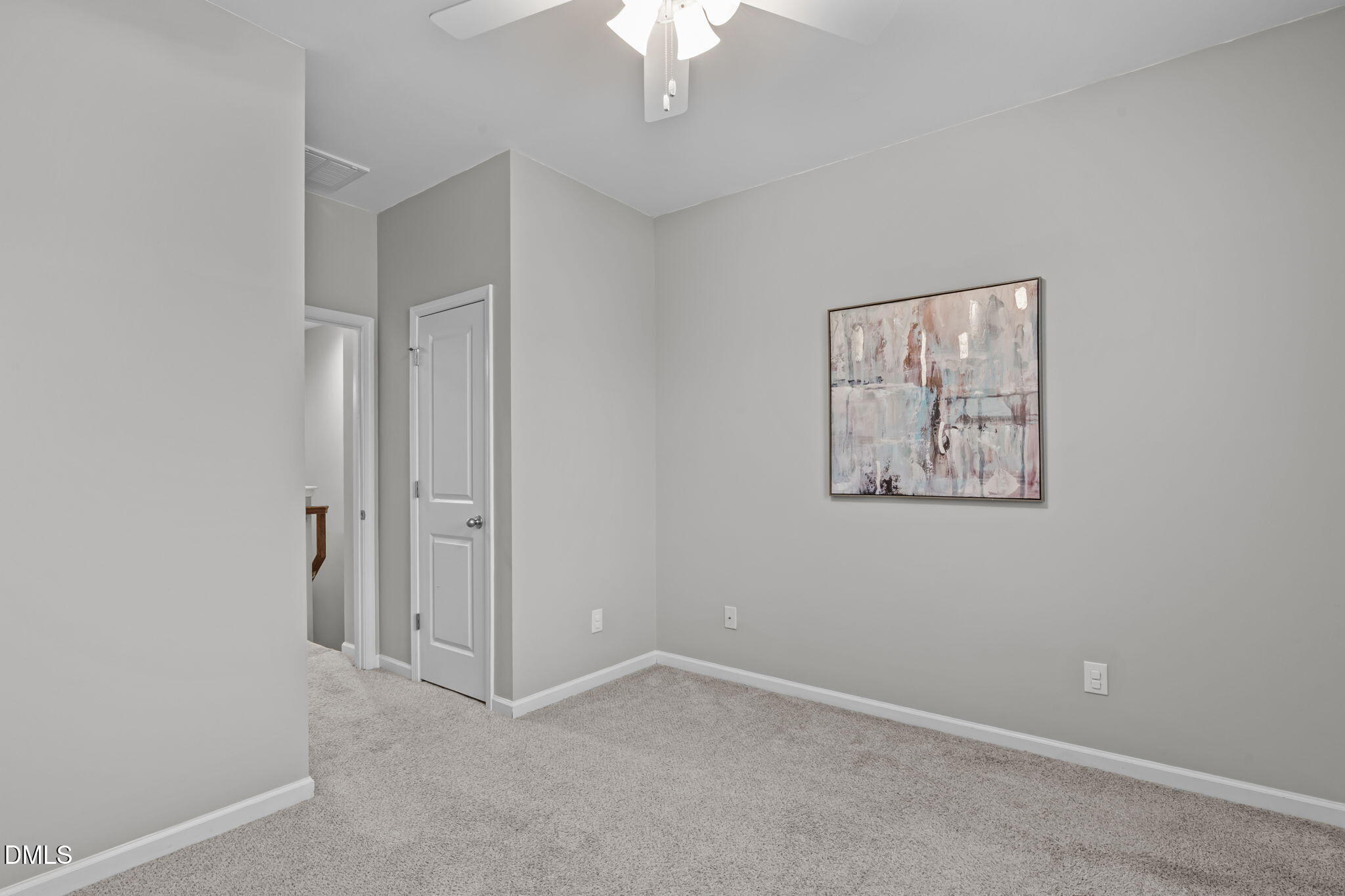 738 Wickham Ridge Road Apex, NC 27539 - Photo 16 of 27 an empty room with a ceiling fan