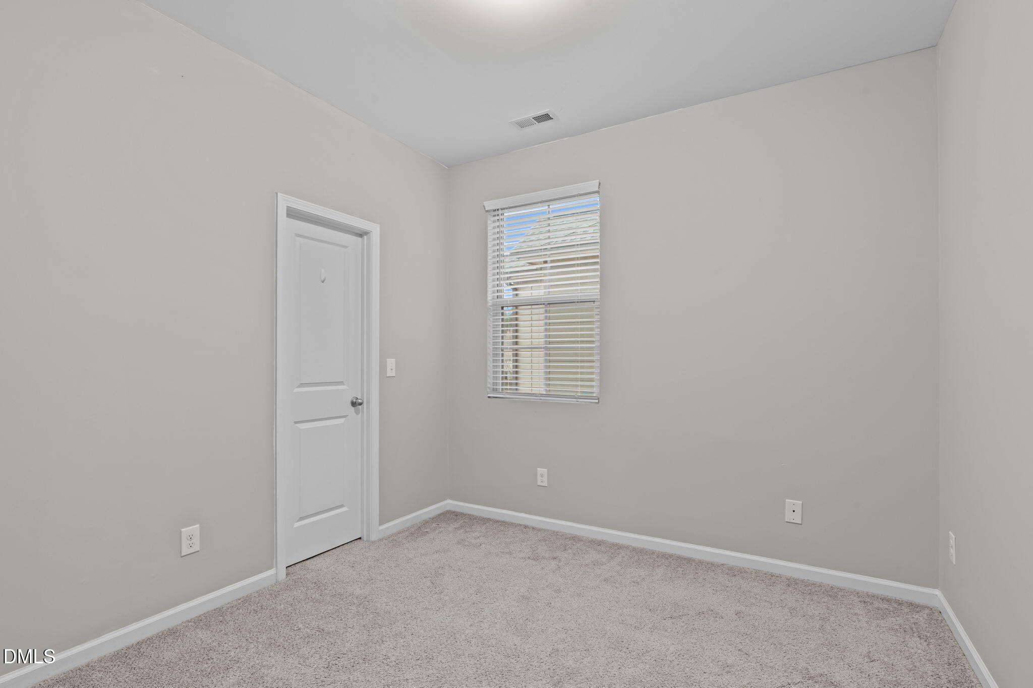 738 Wickham Ridge Road Apex, NC 27539 - Photo 17 of 27 a view of an empty room with a window