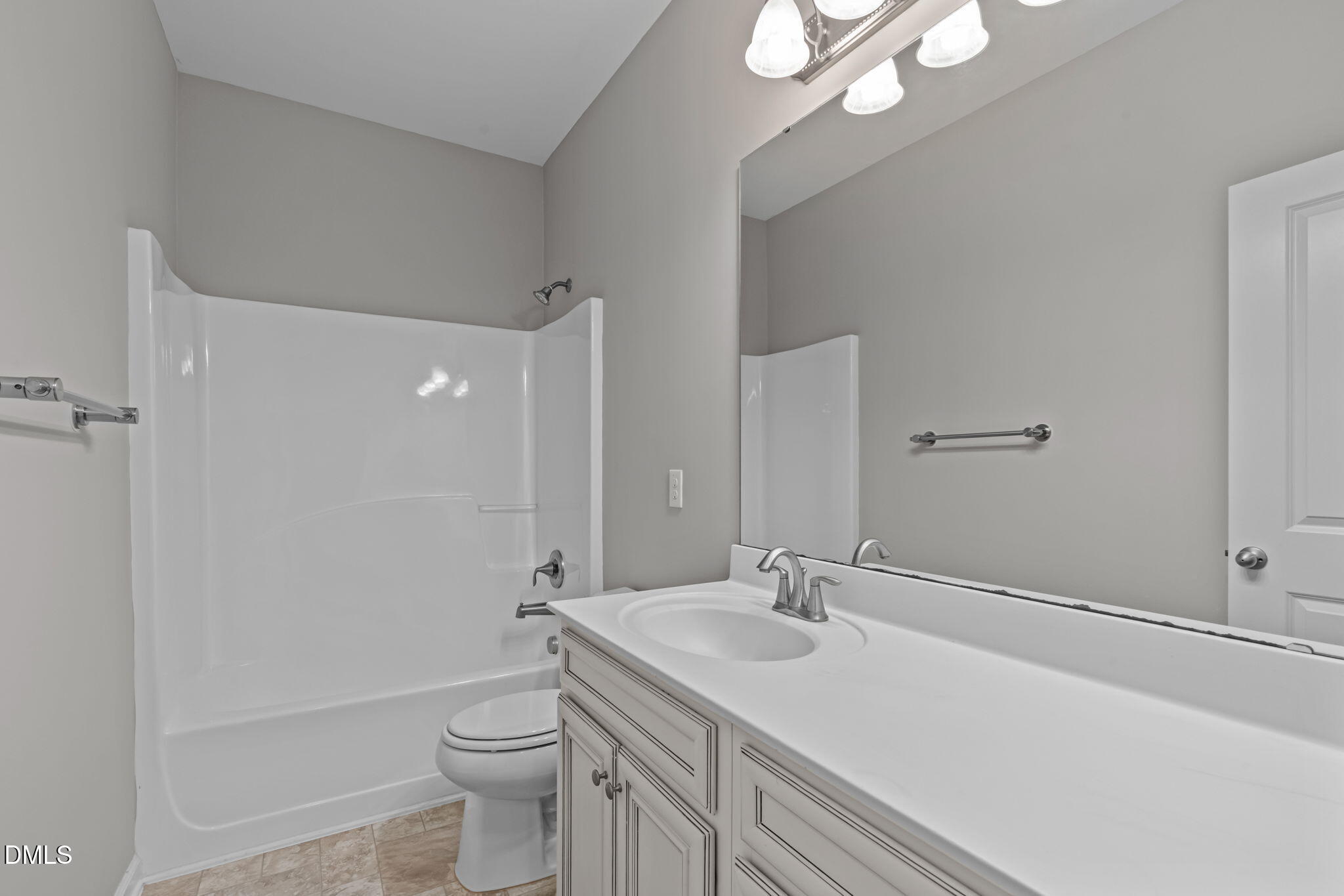738 Wickham Ridge Road Apex, NC 27539 - Photo 19 of 27 a bathroom with a sink a toilet and shower