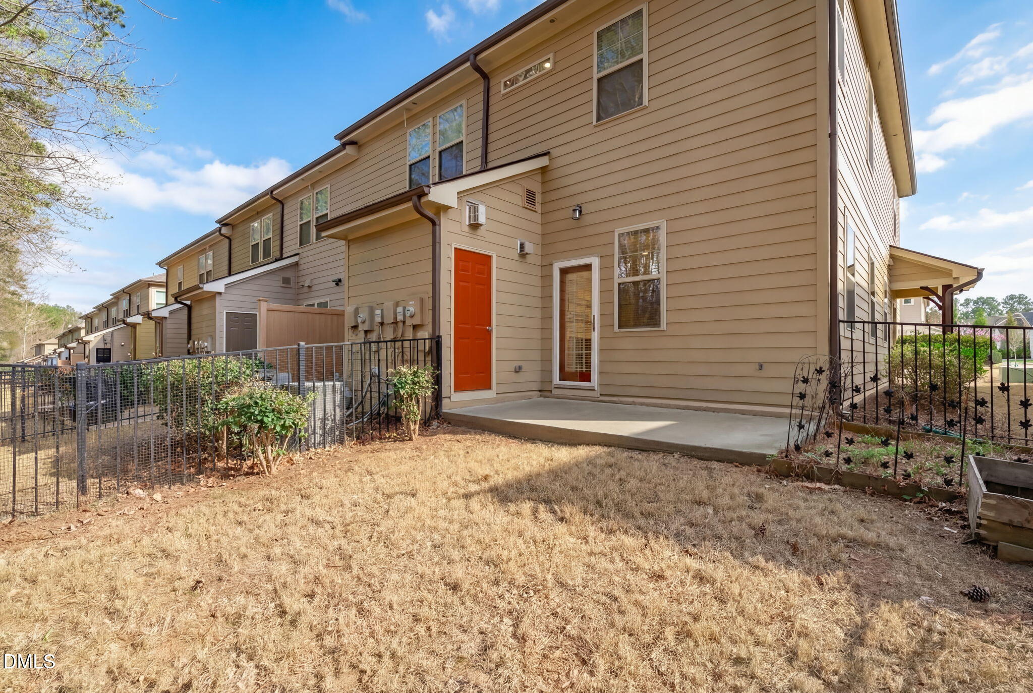 738 Wickham Ridge Road Apex, NC 27539 - Photo 21 of 27 a backyard of a house with large trees and garage