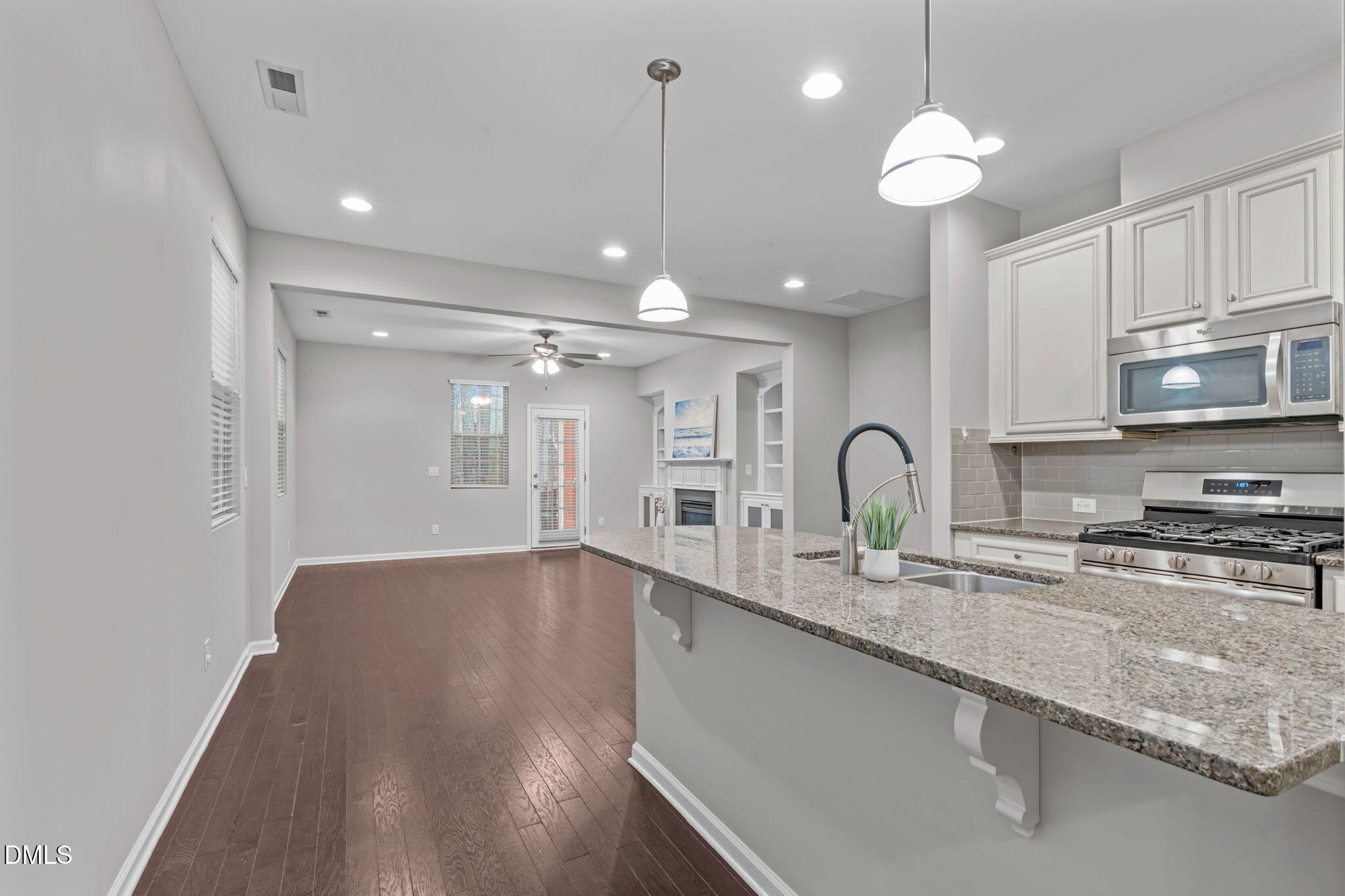 738 Wickham Ridge Road Apex, NC 27539 - Photo 26 of 27 a view of a kitchen with a sink and cabinets