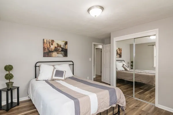 a bedroom with a bed and a table in it