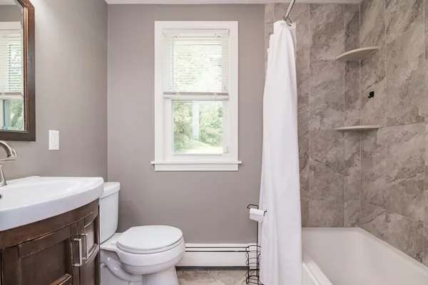 a bathroom with a sink toilet and bathtub