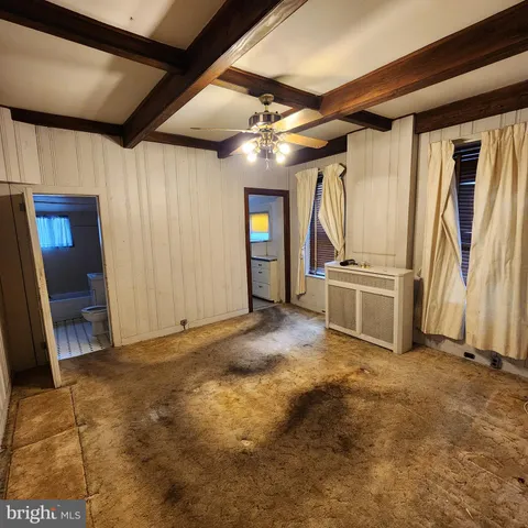 a kitchen with a refrigerator sink stove and cabinets
