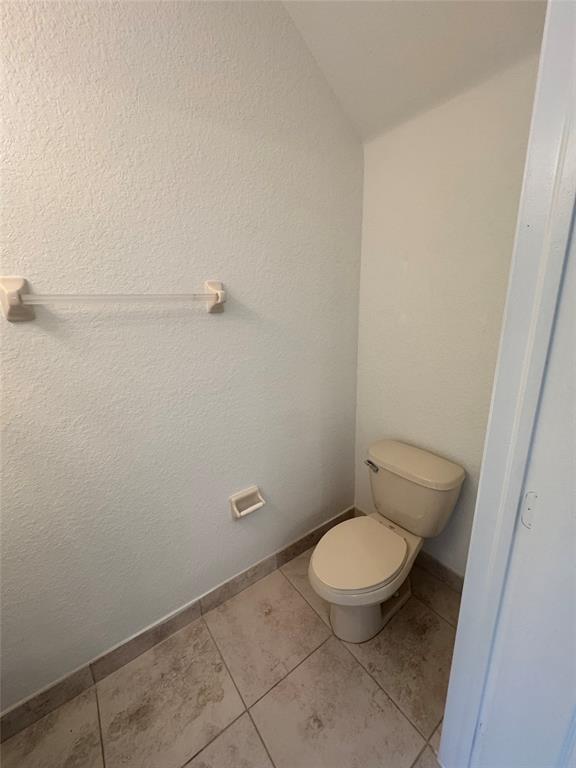 4903 Southwest 140th Terrace Miramar, FL 33027 - Photo 11 of 18 a white toilet sitting next to a white sink and vanity