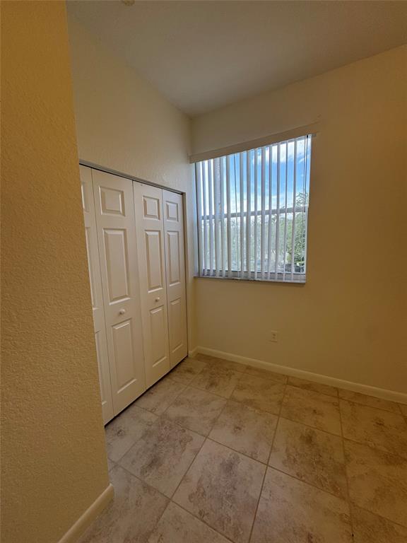 4903 Southwest 140th Terrace Miramar, FL 33027 - Photo 13 of 18 an empty room with windows