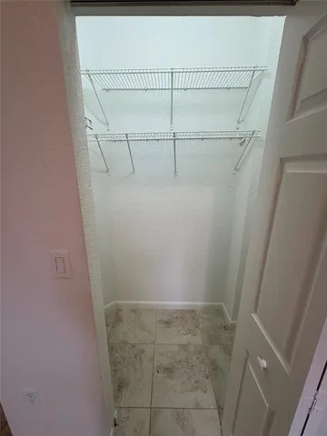 a view of a room with racks on the wall