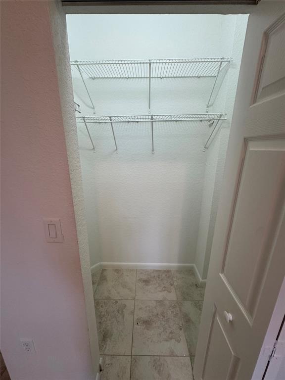 4903 Southwest 140th Terrace Miramar, FL 33027 - Photo 16 of 18 a view of a room with racks on the wall