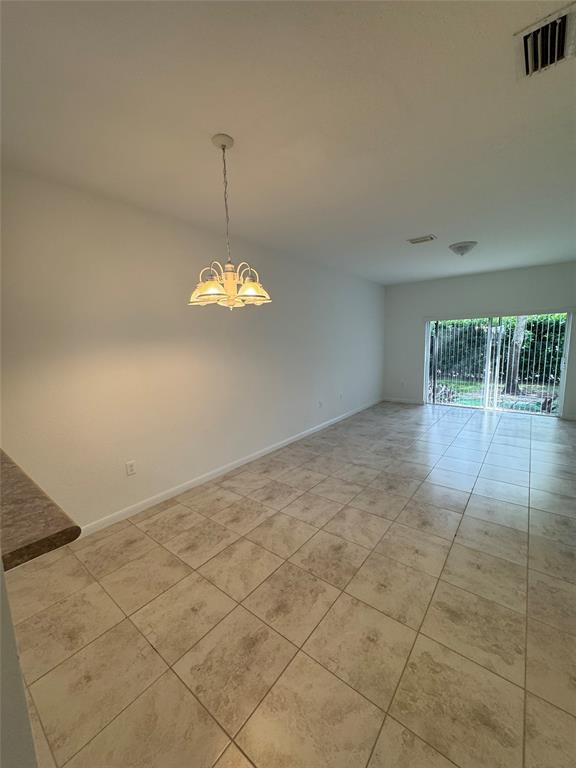 4903 Southwest 140th Terrace Miramar, FL 33027 - Photo 7 of 18 a view of an empty room with a window
