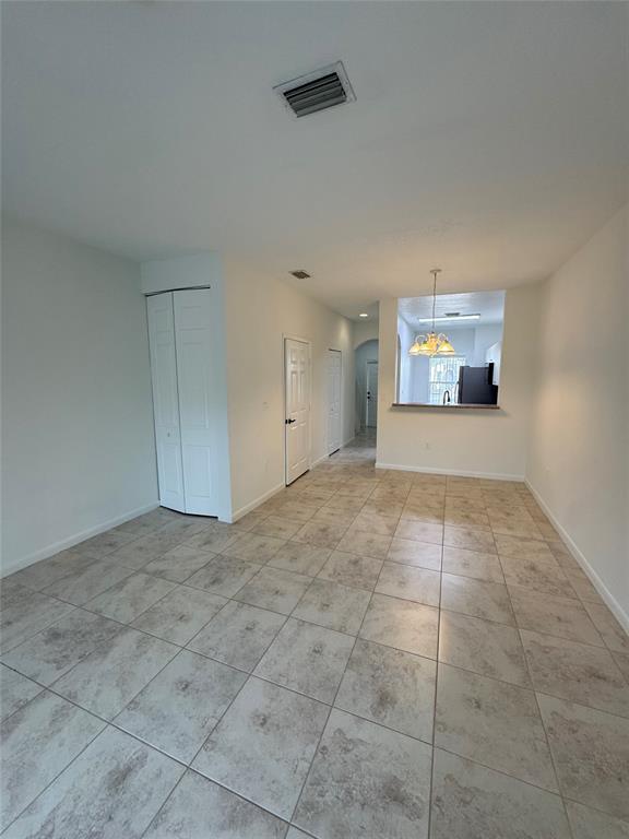 4903 Southwest 140th Terrace Miramar, FL 33027 - Photo 8 of 18 a view of an empty room and window