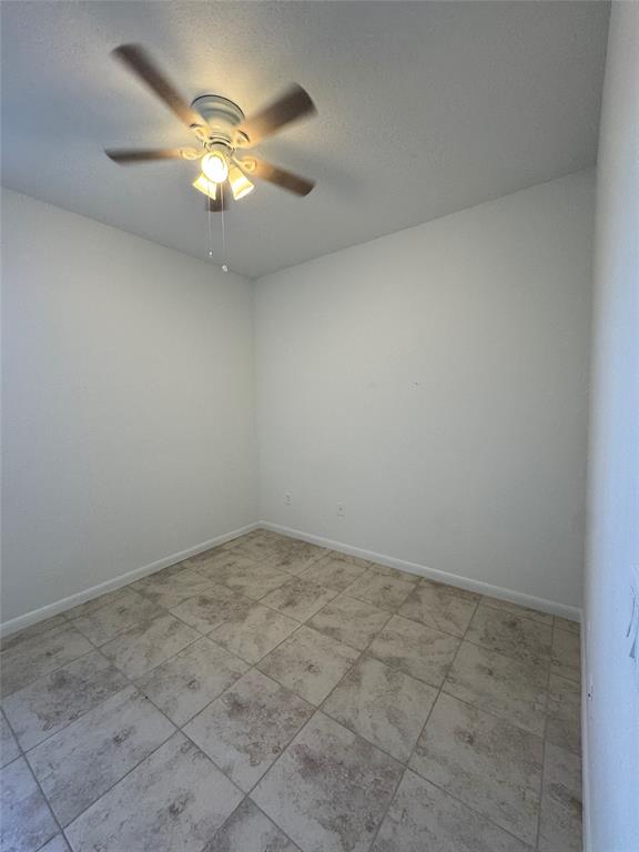 4903 Southwest 140th Terrace Miramar, FL 33027 - Photo 9 of 18 an empty room with a chandelier fan