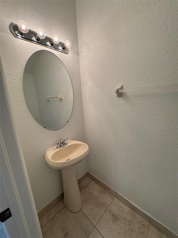 4903 Southwest 140th Terrace Miramar, FL 33027 - Photo 10 of 18 a bathroom with a toilet sink and mirror