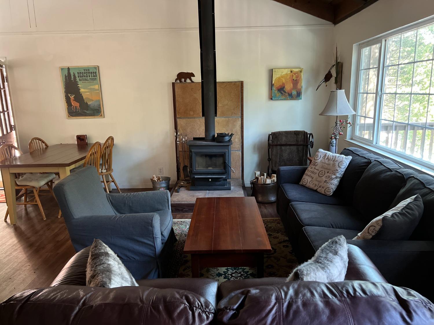 26445 Crystal Road Long Barn, CA 95335 - Photo 18 of 22 a living room with furniture and a fireplace