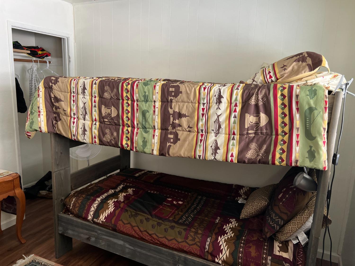 26445 Crystal Road Long Barn, CA 95335 - Photo 8 of 22 a bed sitting in a bedroom next to a window