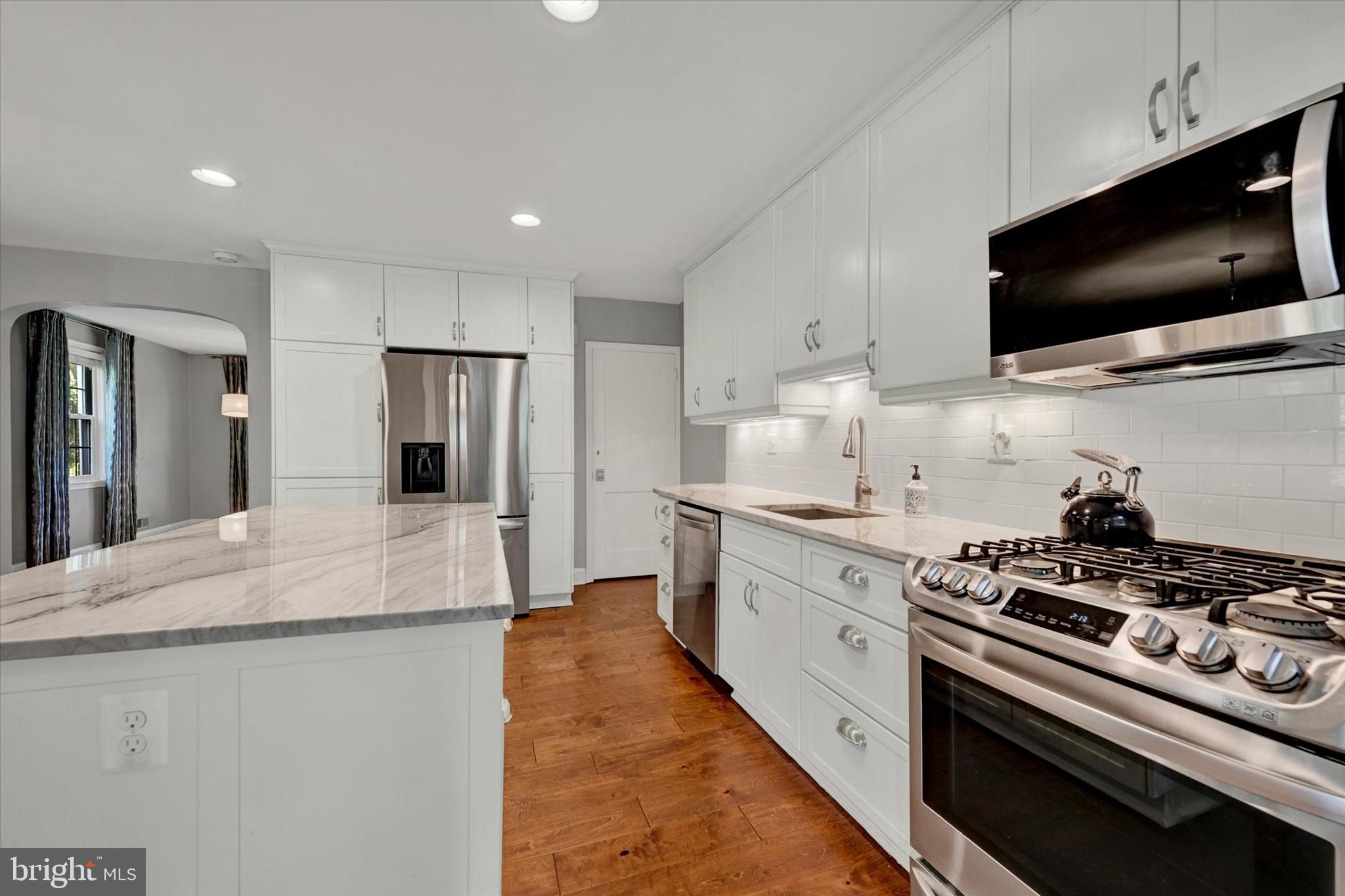 7220 Lanark Road Baltimore, MD 21212 - Photo 11 of 28 a kitchen with stainless steel appliances a stove microwave and refrigerator