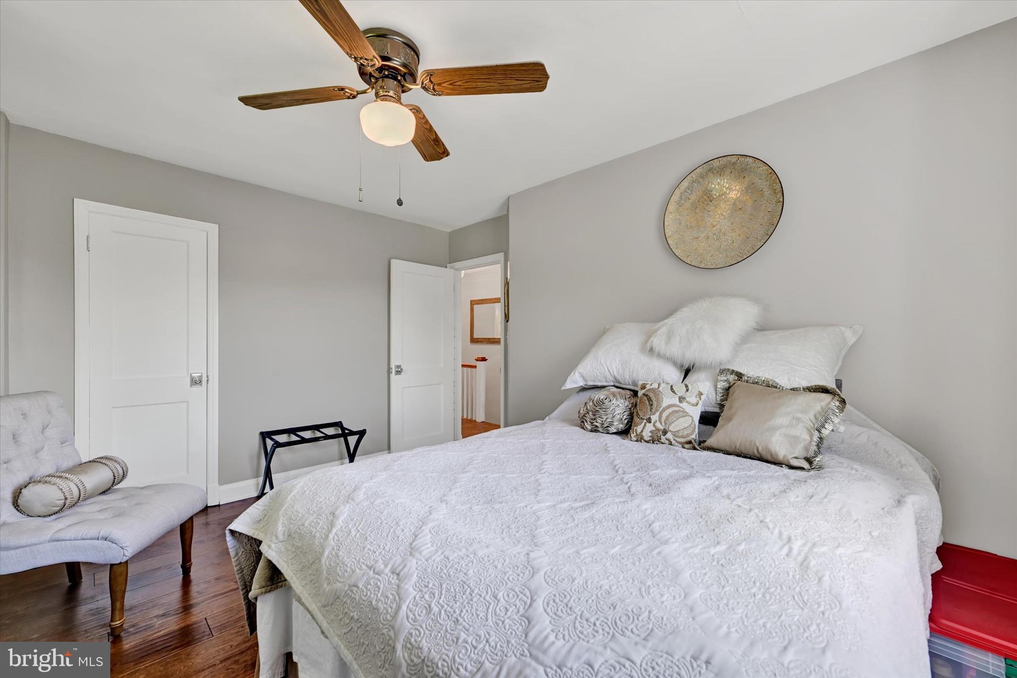 7220 Lanark Road Baltimore, MD 21212 - Photo 14 of 28 a bedroom with a bed and a chandelier