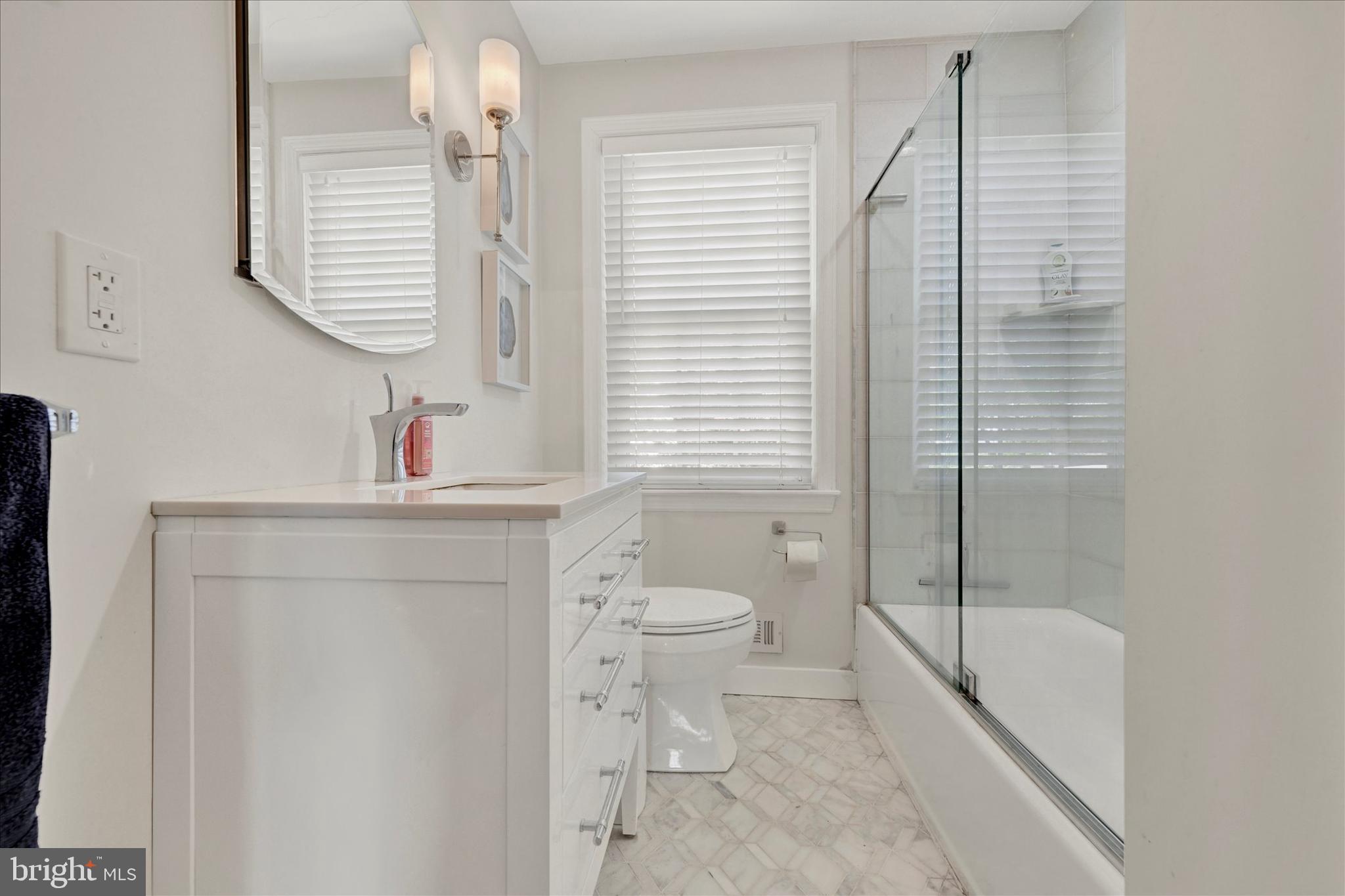 7220 Lanark Road Baltimore, MD 21212 - Photo 18 of 28 a bathroom with a sink a toilet and shower