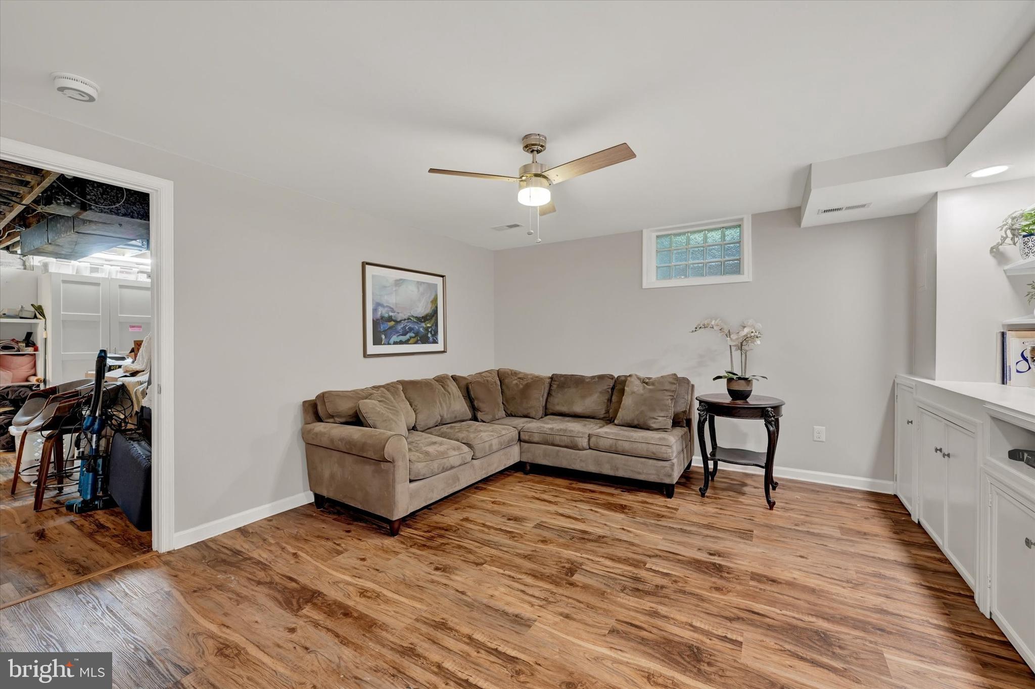 7220 Lanark Road Baltimore, MD 21212 - Photo 19 of 28 a living room with furniture and a wooden floor