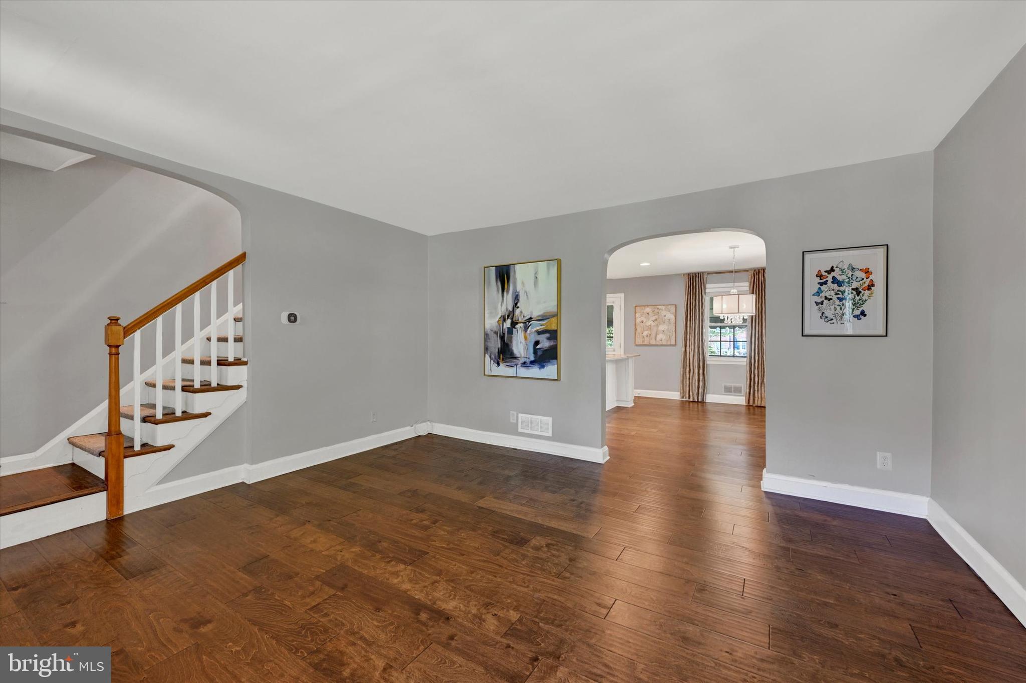 7220 Lanark Road Baltimore, MD 21212 - Photo 3 of 28 a view of an empty room with wooden floor and a window